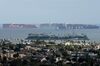 Container ships wait offshore at the Port of Long Beach in Long Beach, California, U.S. on Thursday, March 25.. 