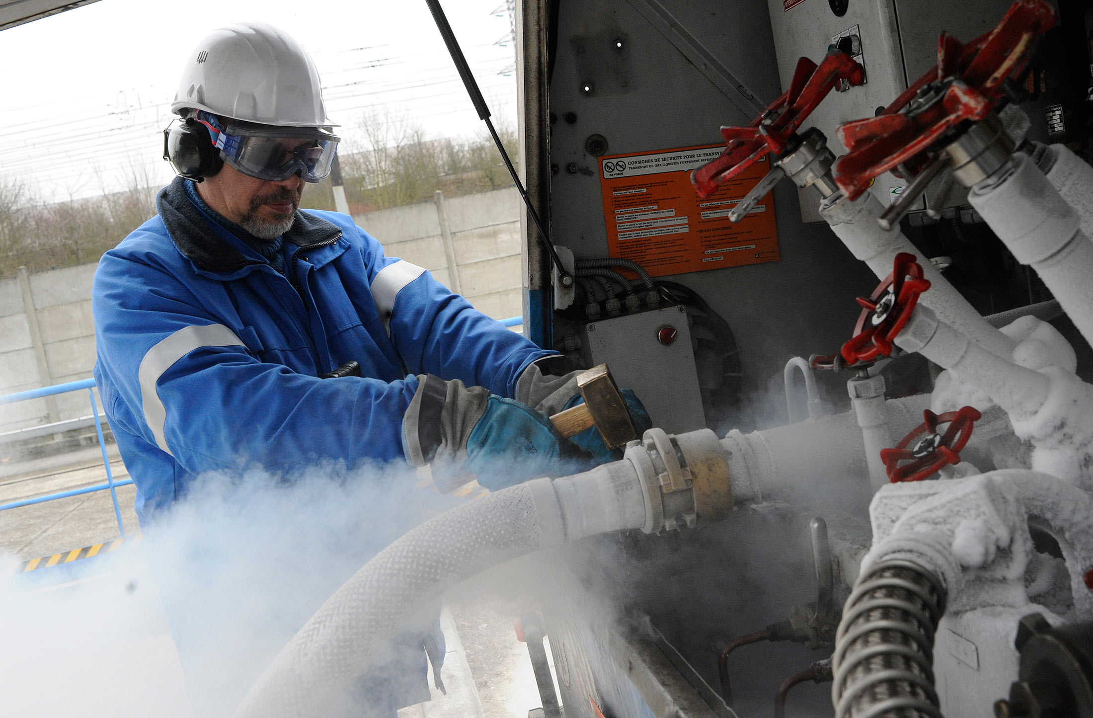 An employee checks valves at the Air Liquide SA factory in Moissy Cramayel, France, on Monday, Feb. 13, 2012.
