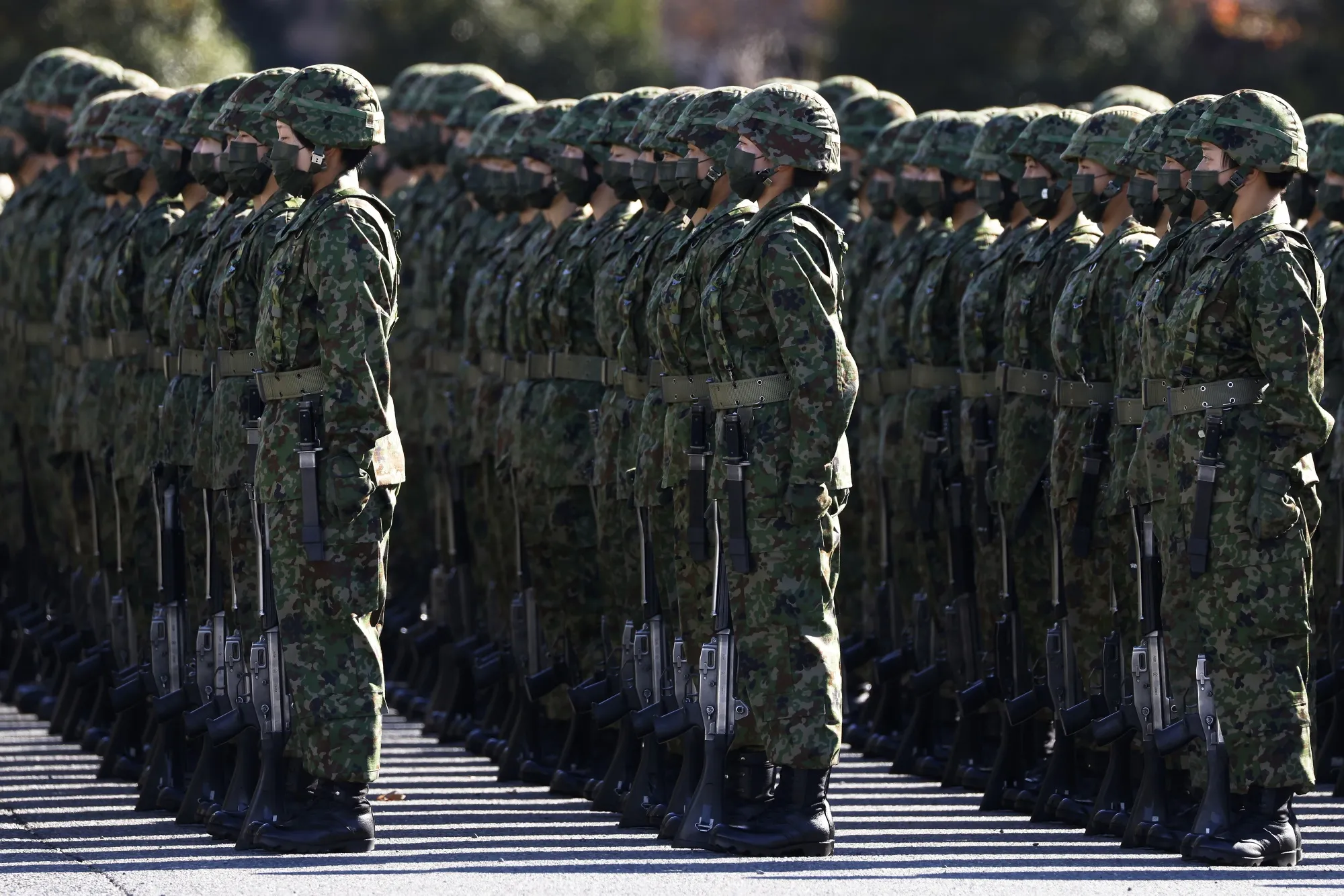 Members of the Japan Ground Self-Defense Force&nbsp;stand in formation during a review at Camp Asaka in Tokyo.