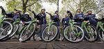 A group of cyclists prepares to take an inaugural ride on new rental bikes Monday, Oct. 13, 2014, in Seattle.
