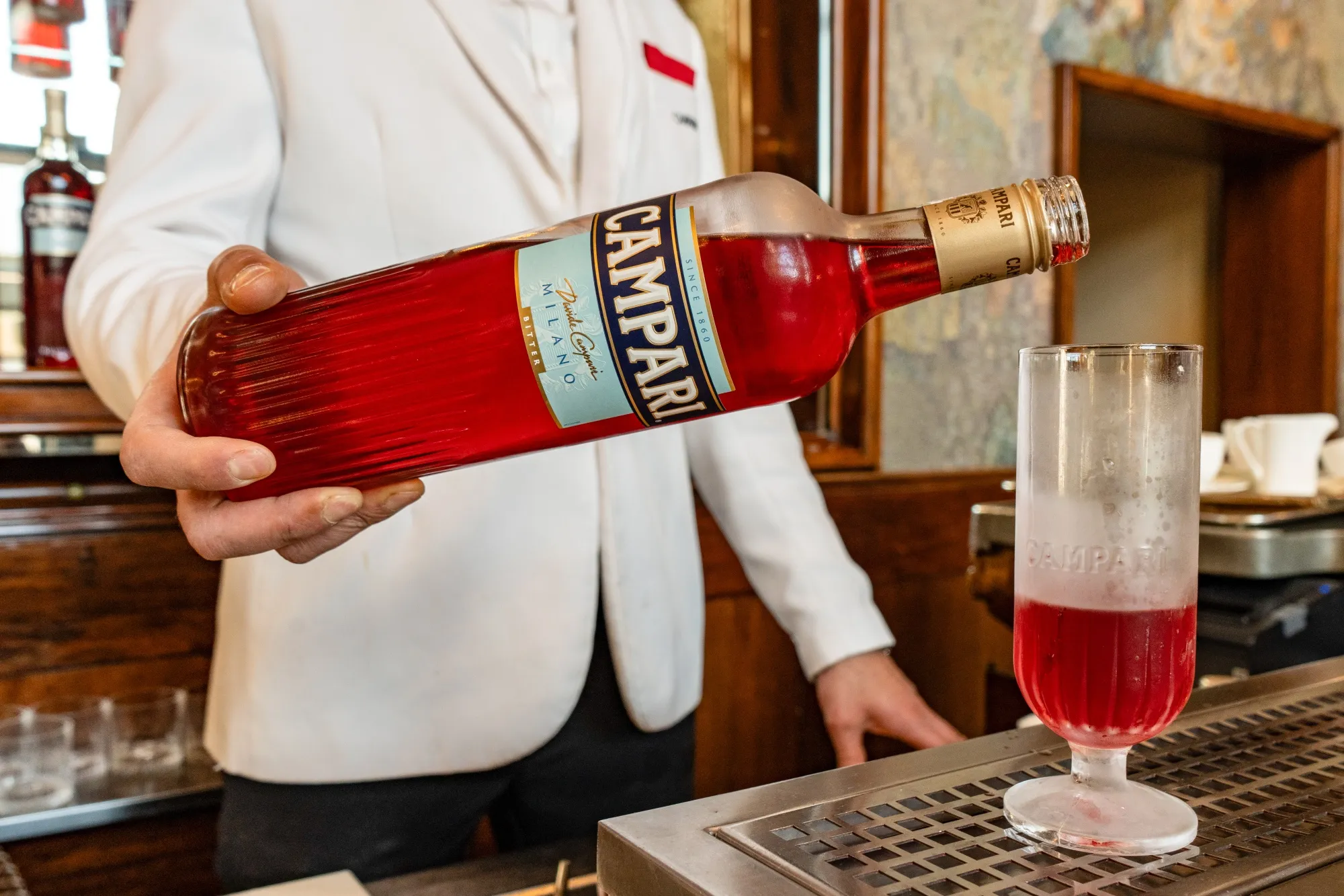 A bartender prepares a Campari Seltz cocktail in the Galleria Vittorio Emanuele II shopping center in Milan.