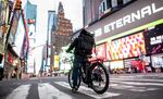 A food delivery man crosses the street in Times Square in Manhattan on March 17.