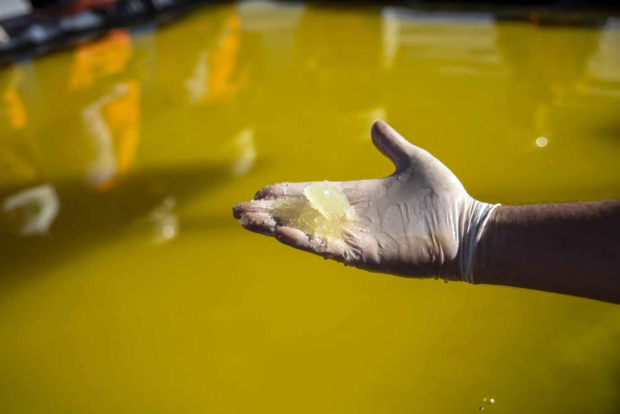 Lithium concentrate at an SQM lithium mine on the Atacama salt flat in the Atacama Desert.