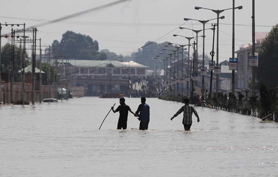 Residents of Srinagar navigate the flooded streets. 