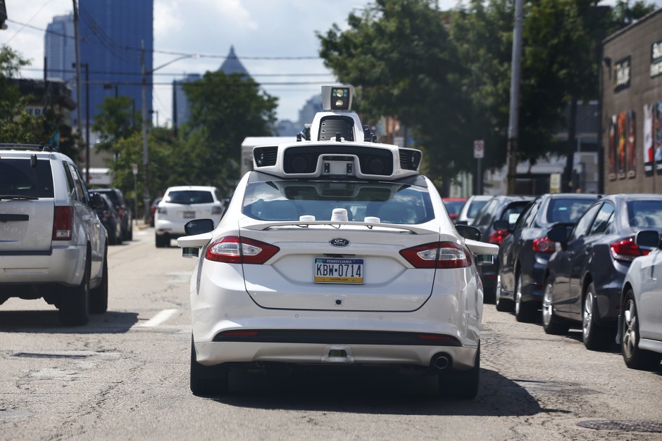 A self-driving Ford Fusion roams the streets of Pittsburgh.