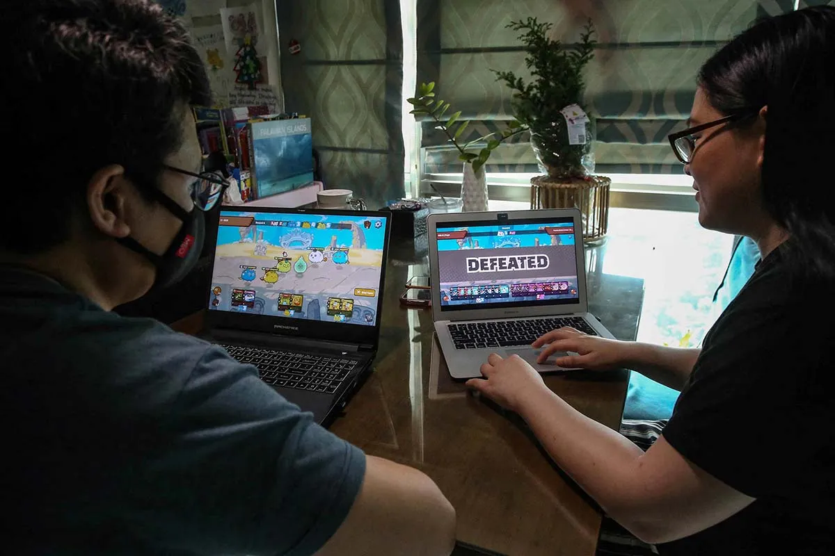 A couple in Manila on the Axie Infinity site.