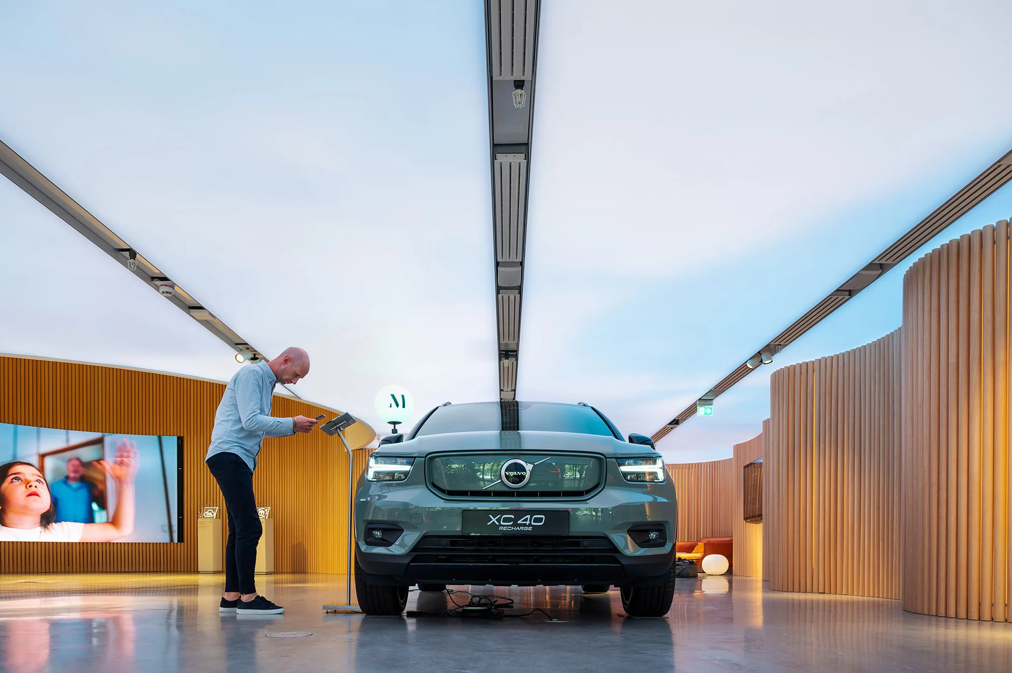 A Volvo XC40 Recharge electric SUV at a dealership in Stockholm.