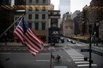 A cyclist rides down Fifth Avenue in New York on March 19.