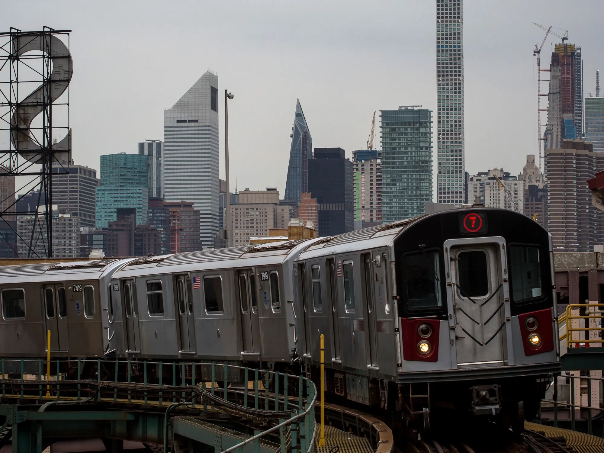 A 7 subway train runs along elevated tracks in the Queens borough of New York.