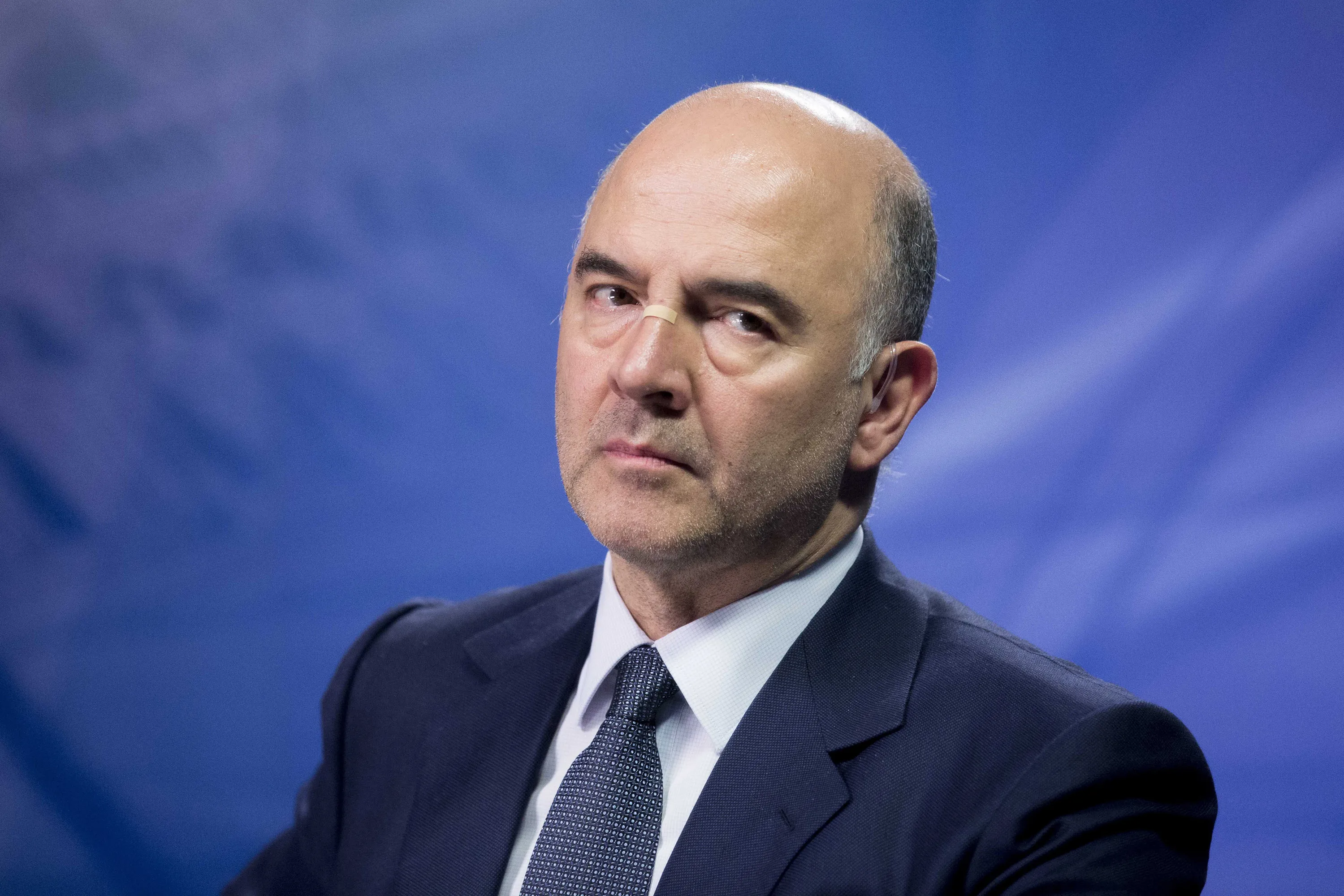 "We have agreed to lighten the interest burden, lengthen the the maturity of the debt" European Commissioner Pierre Moscovici said. Photographer: Christophe Morin/Bloomberg
