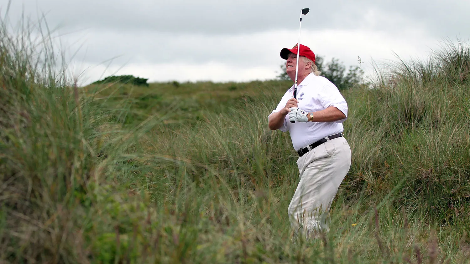 Donald Trump plays a round of golf after the opening of the Trump International Golf Links Course on July 10, 2012, in Balmedie, Scotland.
