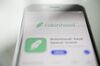 The Robinhood application is displayed in the App Store on an Apple Inc. iPhone in an arranged photograph taken in Washington, D.C., U.S., on Friday, Dec. 14, 2018. The Securities Investor Protection Corp. said a new checking account from Robinhood Financial LLC raises red flags and that the deposited funds may not be eligible for protection.