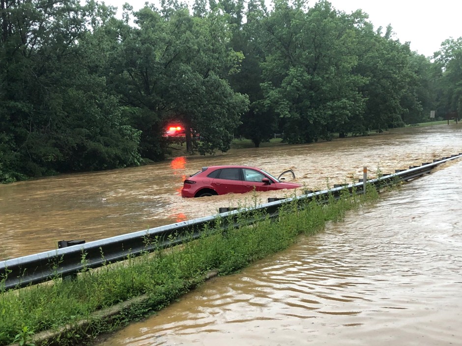 A car is seen in flood waters on Clara Barton Parkway near Washington, D.C. during four inches of rain that fell in just one hour.