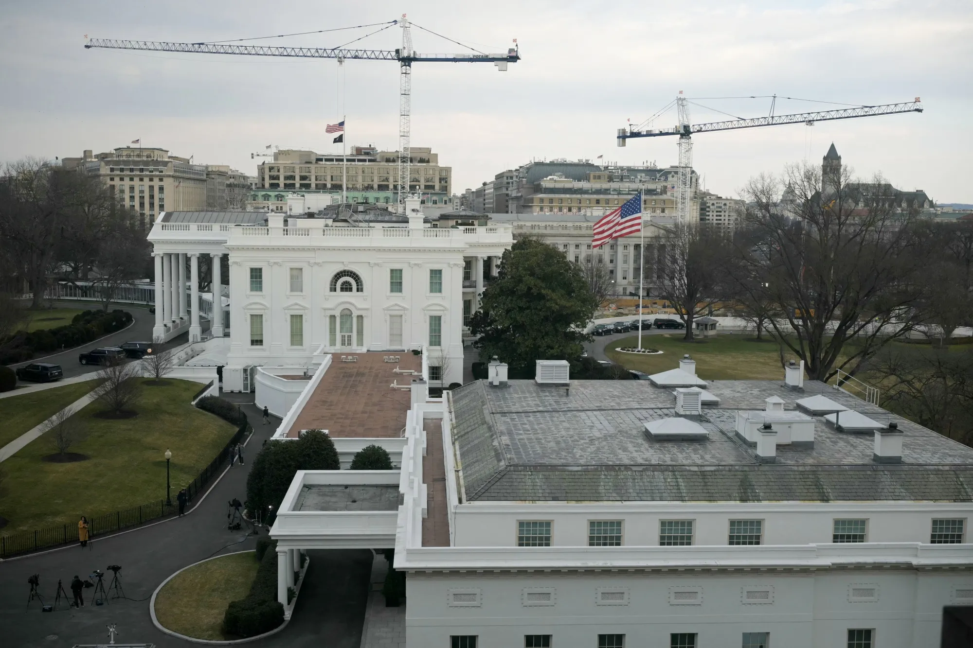 Cranes are seen on the grounds of the White House as construction work continues for President Donald Trump's new ballroom in Washington on February 25.