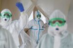Health workers exit a Covid-19 contamination area at the Federal Clinical Center of Higher Medical Technologies near Moscow, on May 12.