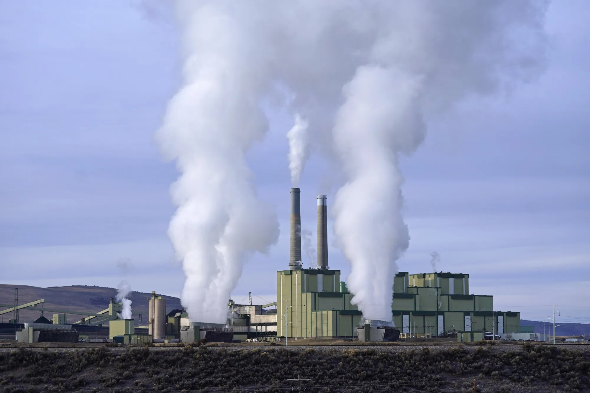 Steam billows from a coal-fired power plant Nov. 18, 2021, in Craig, Colo. The Supreme Court on Thursday, June 30, 2022, limited how the nation’s main anti-air pollution law can be used to reduce carbon dioxide emissions from power plants. By a 6-3 vote, with conservatives in the majority, the court said that the Clean Air Act does not give the Environmental Protection Agency broad authority to regulate greenhouse gas emissions from power plants that contribute to global warming. (AP Photo/Rick Bowmer, File)