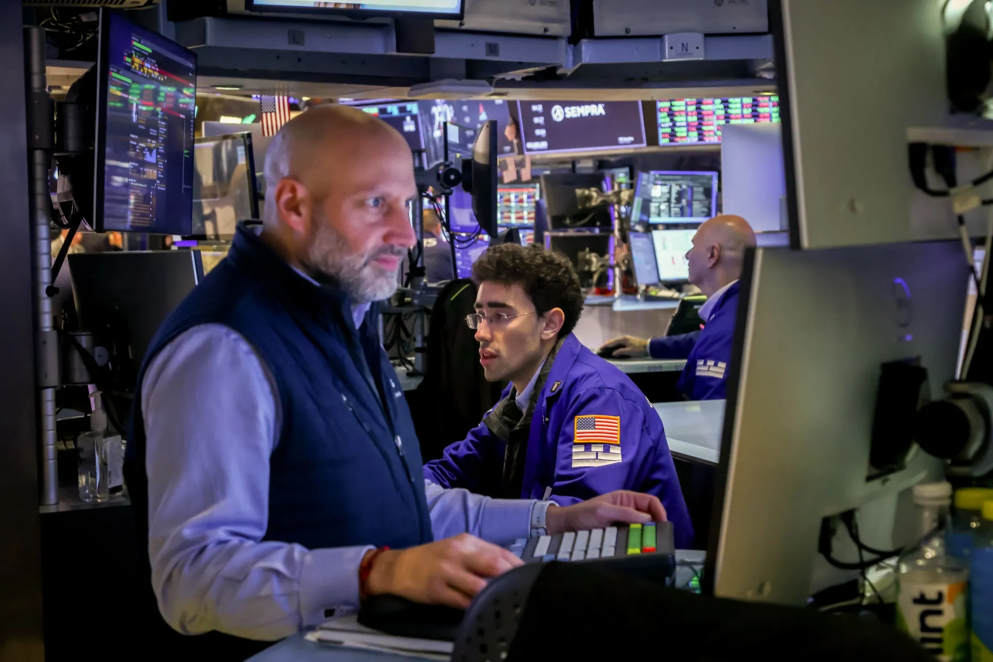 Traders work on the floor of the New York Stock Exchange.