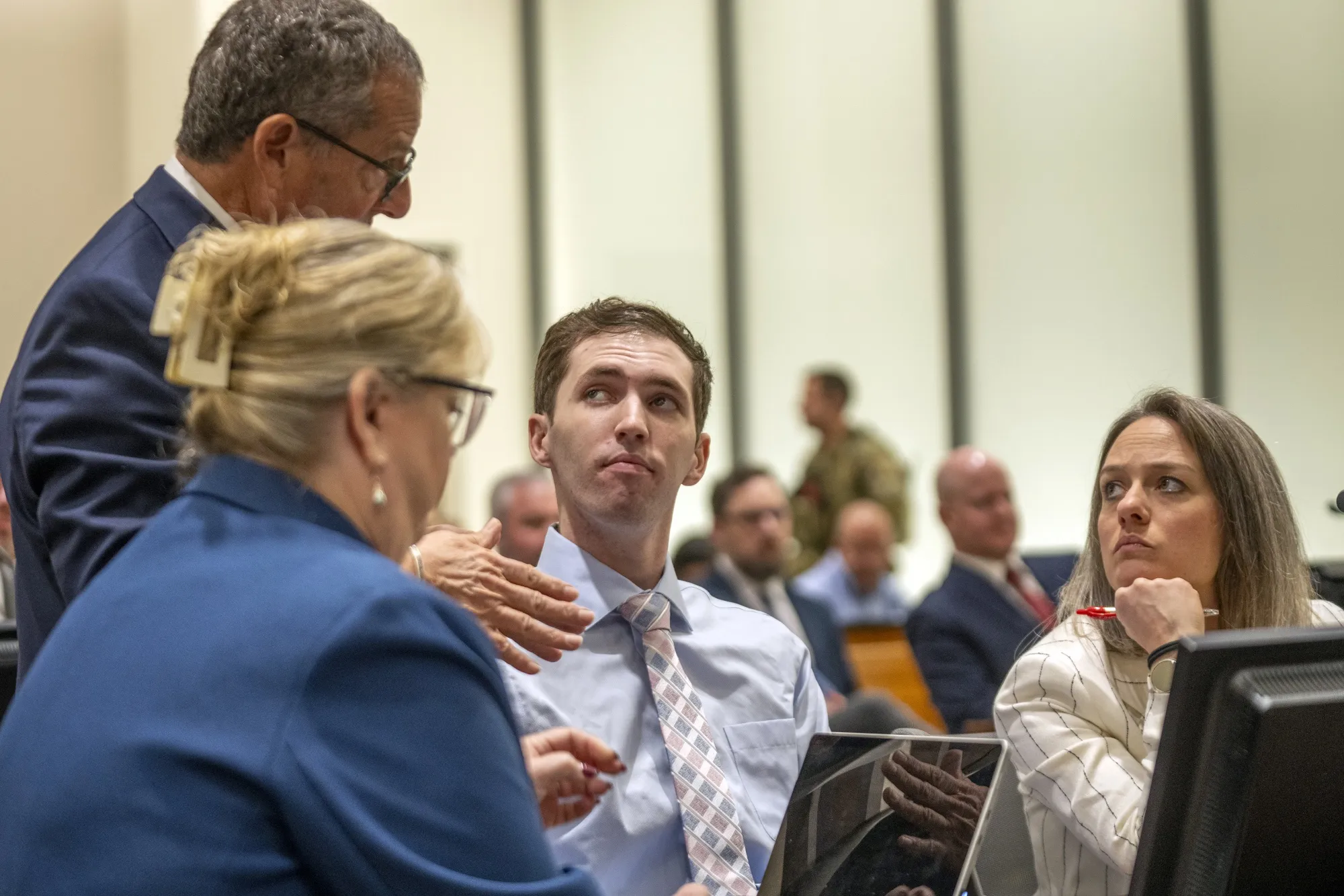 Tyler Robinson, center, with his attorneys during a hearing in Fourth District Court on Dec. 11.