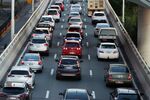 Vehicles travel along a freeway in Brisbane, Australia.