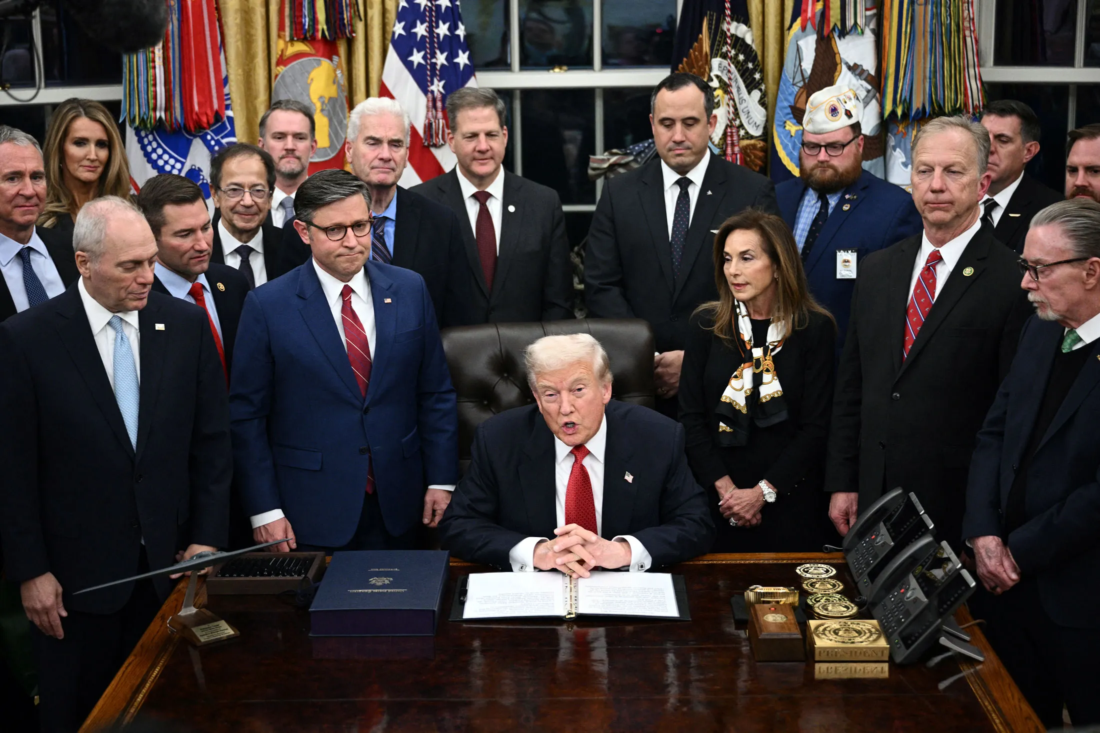 US President Donald Trump in the Oval Office on Nov. 12. The Rolex table clock is visible on his desk.