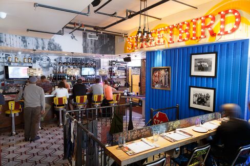 The bar in the back, strung with lamps made from old cassette tapes.
