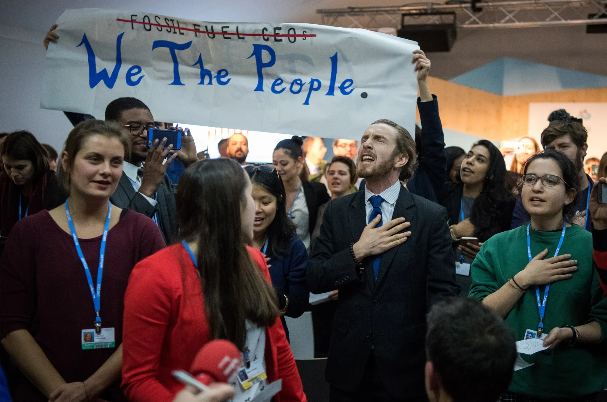 People disturb an event titled: "The Role of Cleaner and More Efficient Fossil Fuels and Nuclear Power in Climate Mitigation" with friendly singing at the COP 23 United Nations Climate Change Conference on Nov. 13, 2017 in Bonn, Germany.&nbsp;