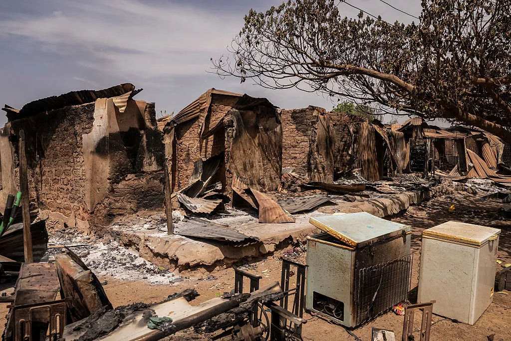 Burnt debris and damaged homes following an attack in Woro, Kwara State, Nigeria.