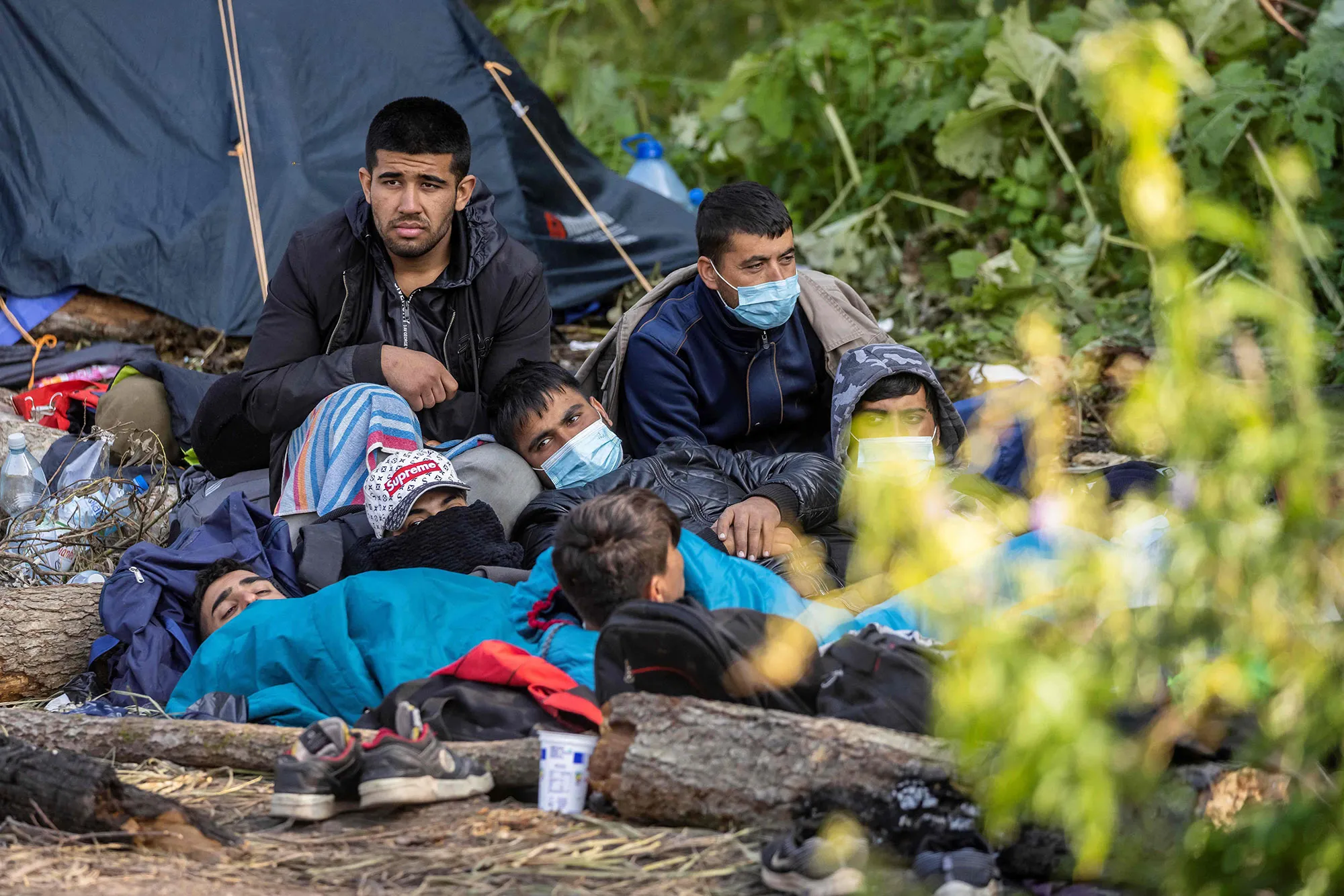 Migrants at a makeshift encampment on the border between Belarus and Poland.