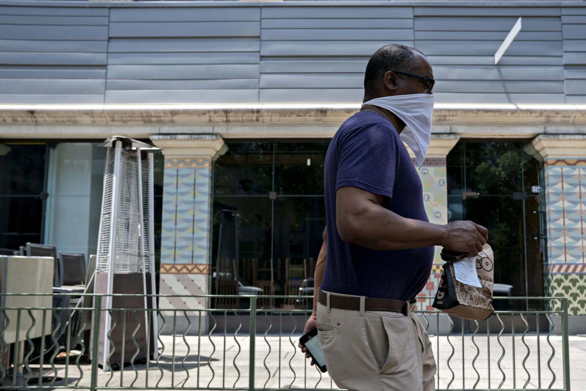A pedestrian passes the closed Montmarte restaurant in Washington, D.C., on June 4.