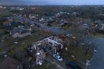 Debris litters the ground surrounding homes, damaged by a tornado, on Oxford Drive and Stratford Drive in Round Rock, Texas Monday, March 21, 2022. (Jay Janner/Austin American-Statesman via AP)