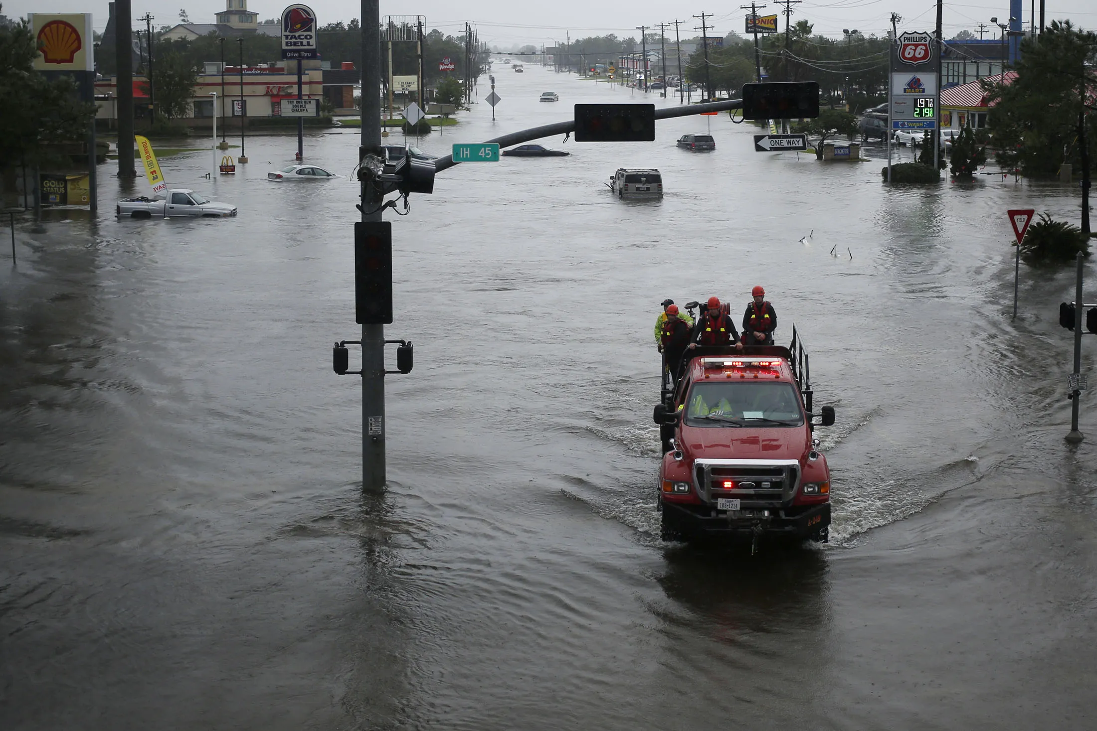 Rescue personnel drive through floodwaters from Hurricane Harvey in Dickinson, Texas on Aug. 29, 2017.