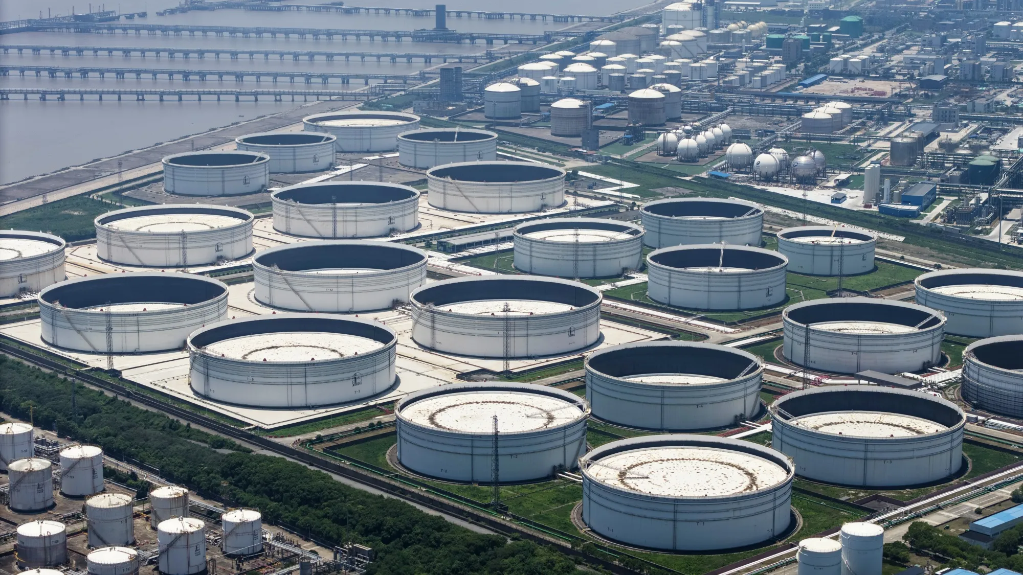 Oil storage tanks at a petrochemical production base on the outskirts of Shanghai, China, on Saturday, June 28, 2025.