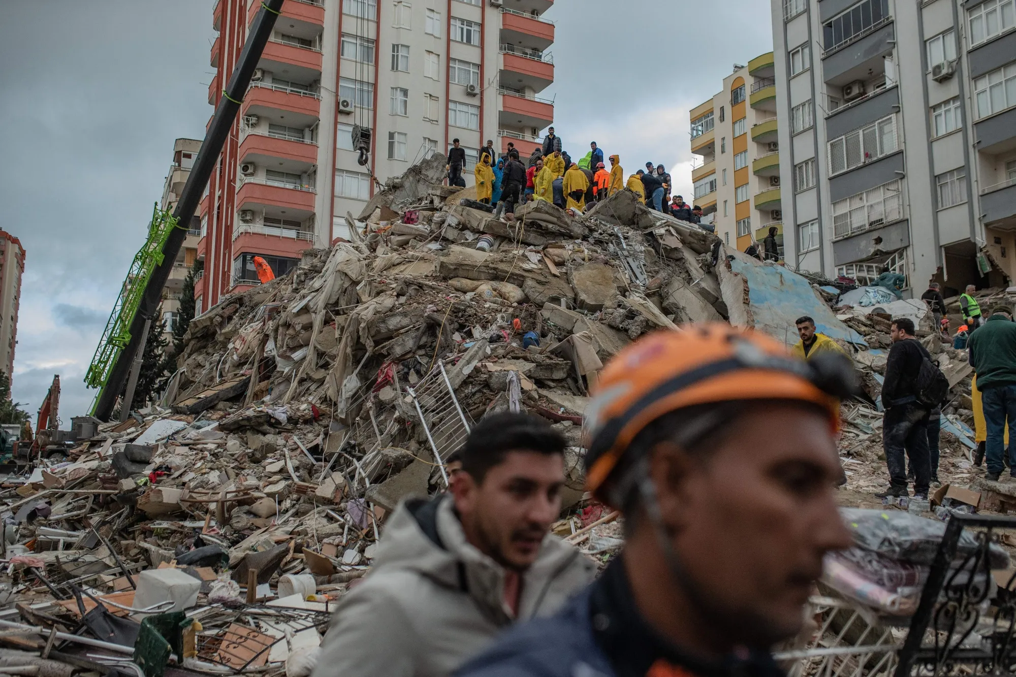 Rescuers searching for survivors in&nbsp;the rubble of a collapsed building in Adana, Turkey, on Monday.