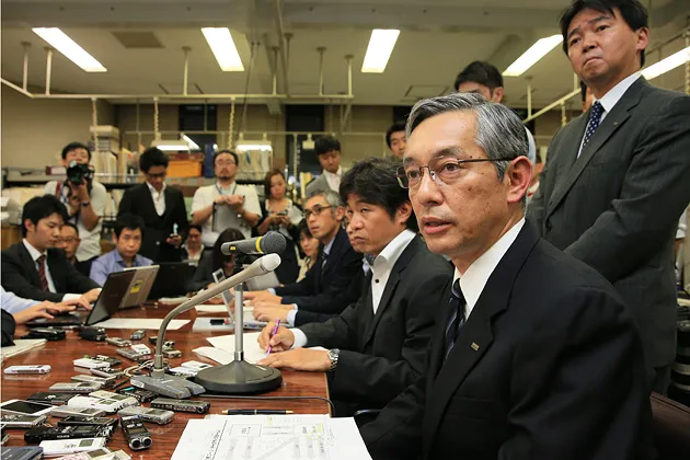 Mizuho Financial Group Vice President Tsugutoshi Okabe attends a press conference at Bank of Japan headquarters in Tokyo on Oct. 4