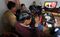 Villagers watch as Zheng Yanxiong who is