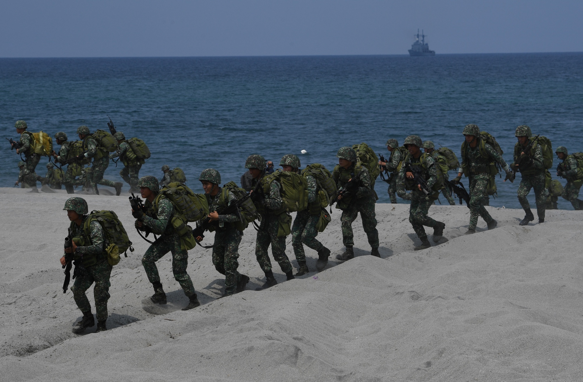 Philippine marines take position as part of the annual Philippines and US joint military exercise at the beach of Philippine navy's training camp in San Antonio, Zambales province in Philippines in 2019.