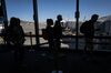 Travelers board a flight in San Francisco, on Oct. 15.
