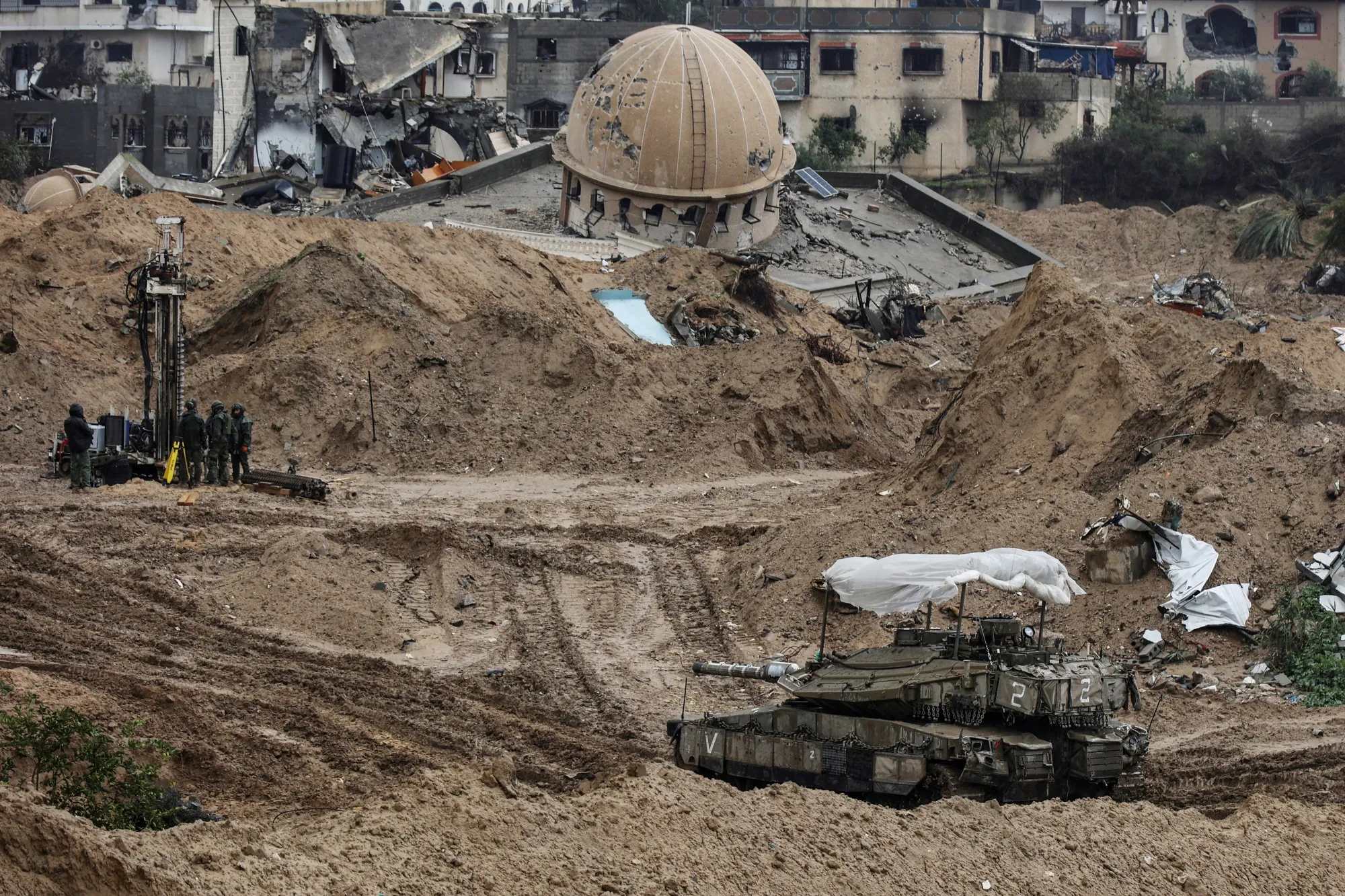 An Israeli tank near the destroyed Hamza mosque in Khan Yunis, taken during an Israeli military-controlled tour, on Jan. 27.
