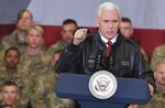 U.S. Vice President Mike Pence arrives on stage to address troops in a hangar at Bagram Air Field in Afghanistan on Dec. 21, 2017.&nbsp;