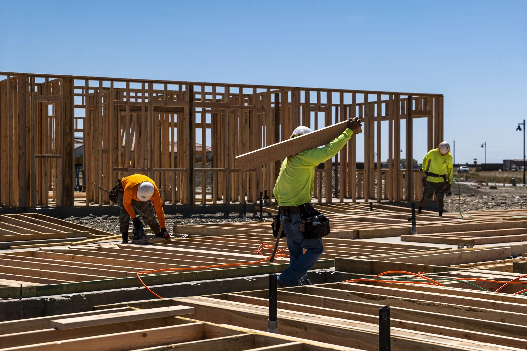 Contractors frame walls on a house&nbsp;in Folsom, California.