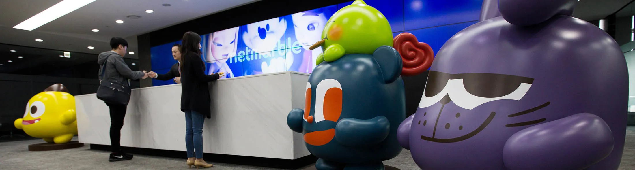 Model figures of Netmarble Friends stand in the reception area at the Netmarble Games Corp. headquarters in Seoul, South Korea, on Friday, April 14, 2017. Netmarble, South Korea's largest maker of mobile phone games, filed to raise as much as 2.7 trillion won ($2.4 billion) in an initial public offering.

