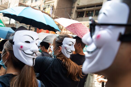 Hong Kong to Enact Rare Emergency Rule for Mask Ban, Reports Say
