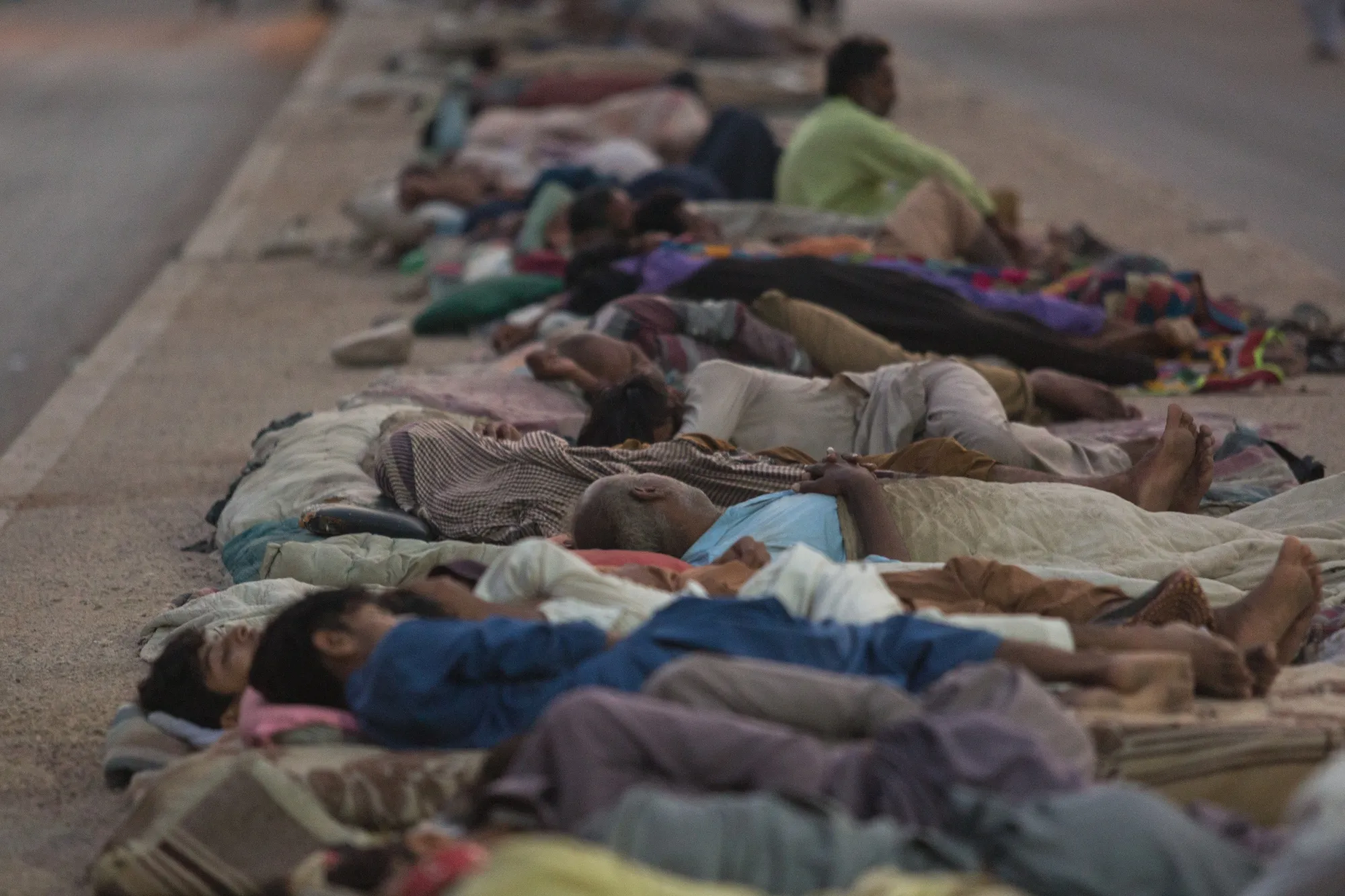 Residents sleep on a street outside their houses to escape the heat during a load-shedding power outage period in Karachi, Pakistan&nbsp;on June 9, 2022.