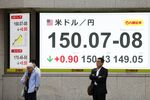 A screen displays the rate of the yen against the US dollar outside a securities firm in Tokyo, on Oct. 6.