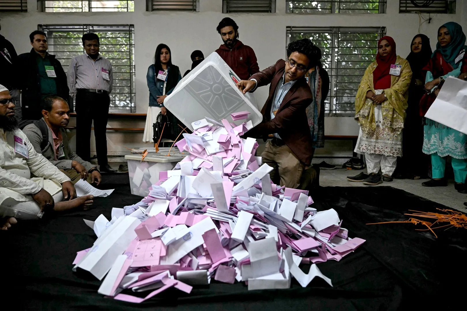 An electoral official opens a ballot box as counting starts at a polling station during Bangladesh's general election in Dhaka on Feb. 12.&nbsp;
