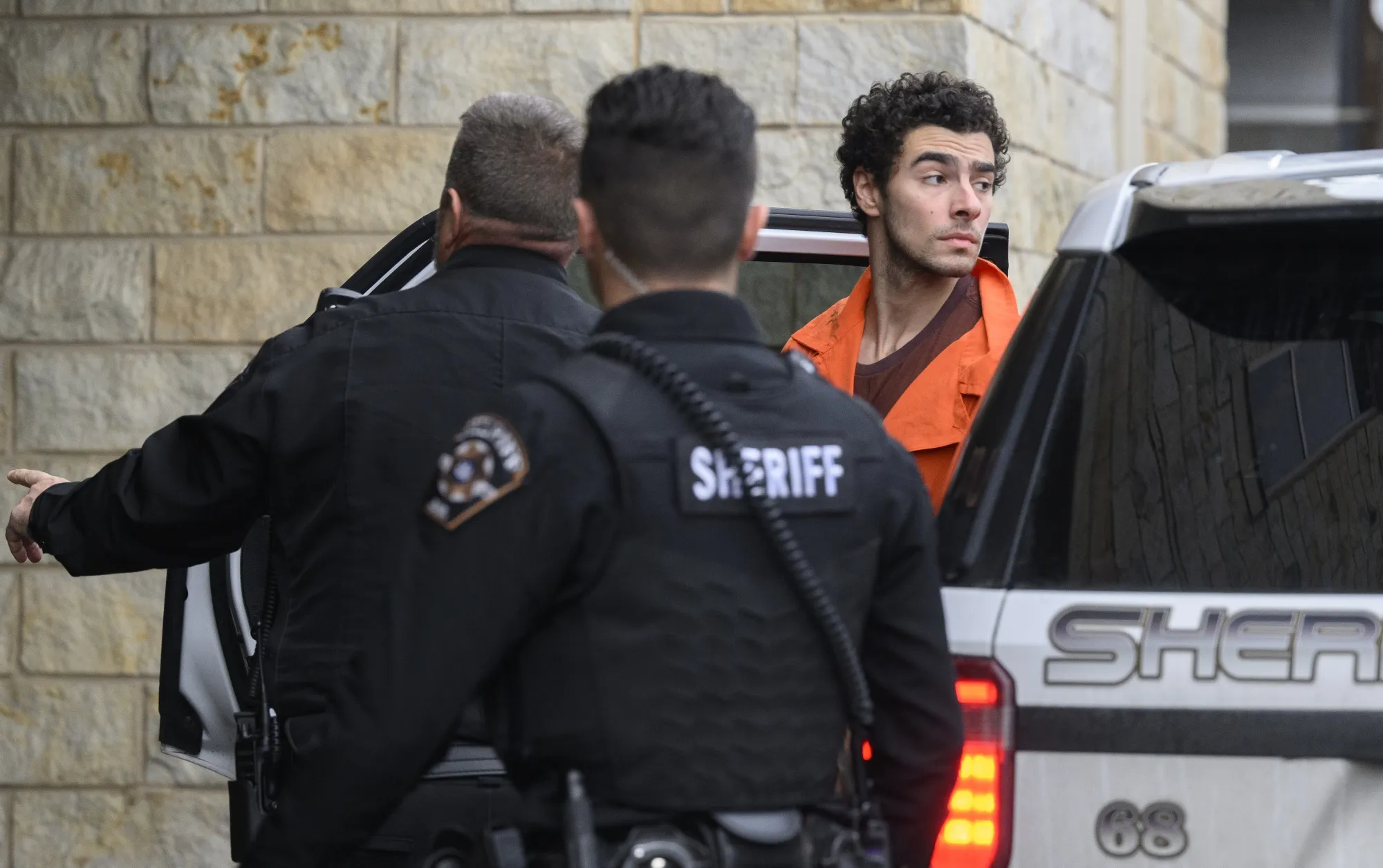 Police take Luigi Mangione into court in Hollidaysburg, Pennsylvania, on Dec. 10.