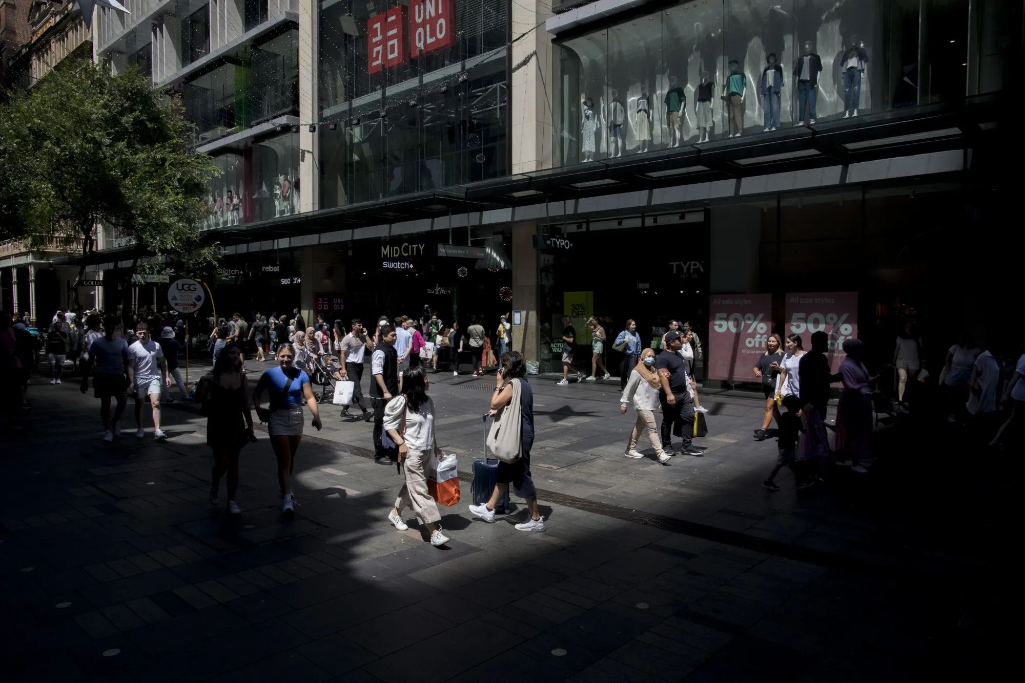 Pedestrians by the retail stores at Pitt Street Mall in Sydney, New South Wales, Australia.