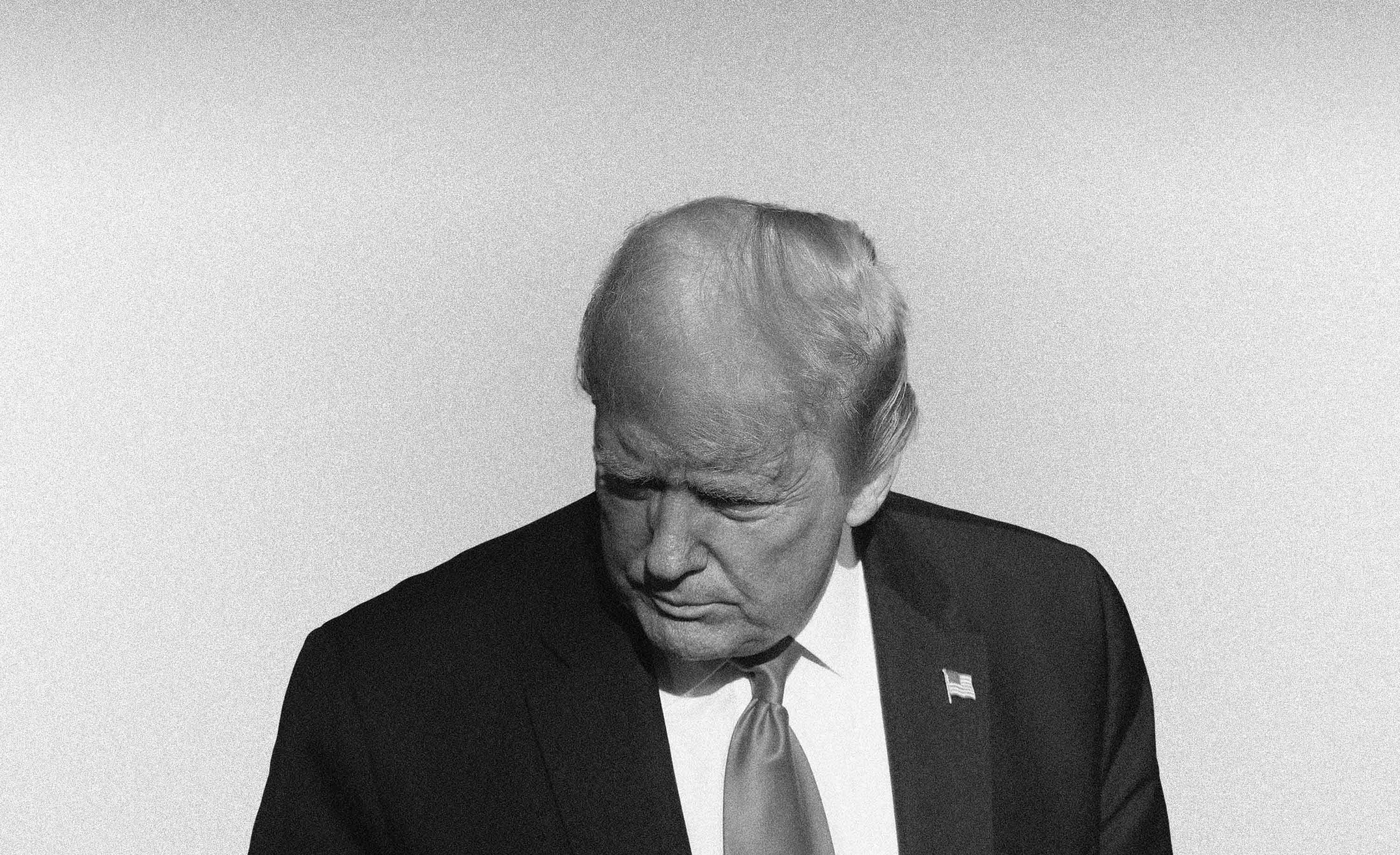 Grainy black and white composite of photo looking down on Donald Trump's head and shoulders silhouetted against a soft gray gradient background