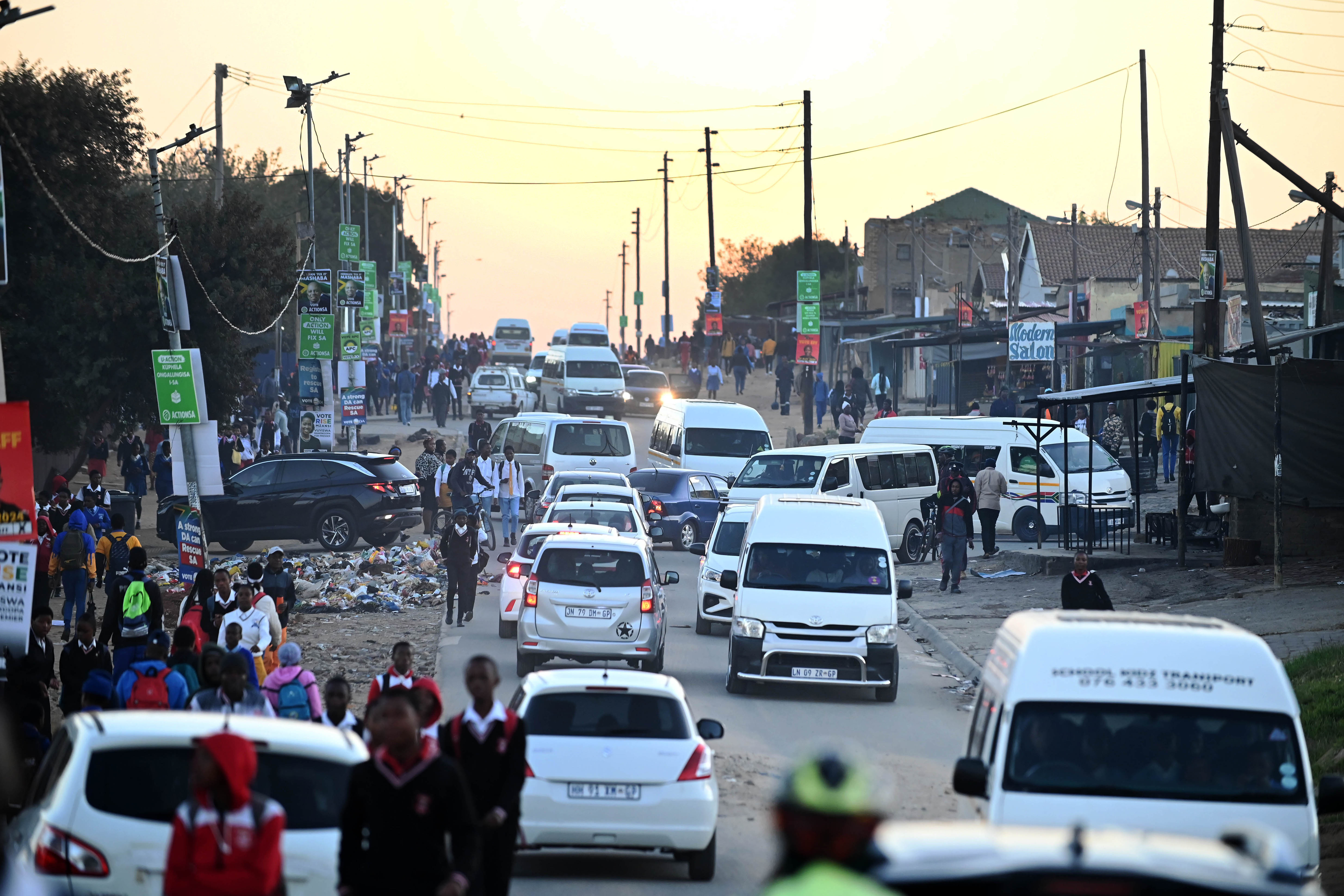 Morning commuters make their way to work and school in the Diepsloot township of Johannesburg, South Africa, on Friday, May 17, 2024. Thirty miles from central Johannesburg, Diepsloot has mushroomed in size since it was established in 1995 as a temporary dwelling for people evicted from informal settlements, and as of 2011 it was home to more than 138,000 residents. Photographer: Leon Sadiki/Bloomberg