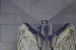 An eagle sculpture stands on the facade of the Marriner S. Eccles Federal Reserve building in Washington, D.C., U.S.